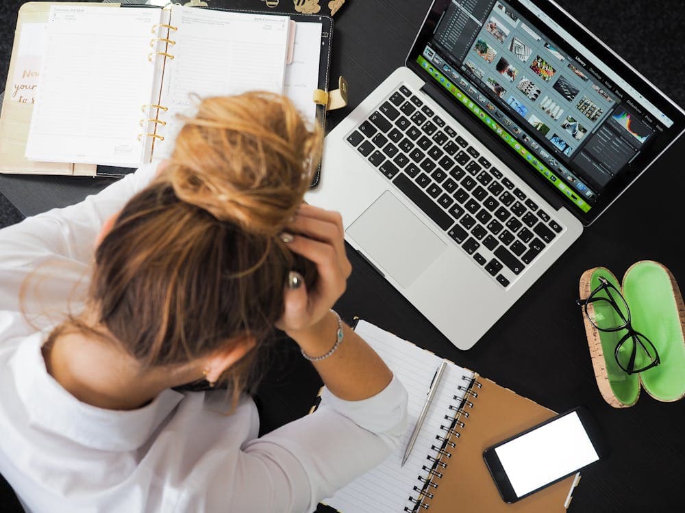 A frustrated professional at their desk